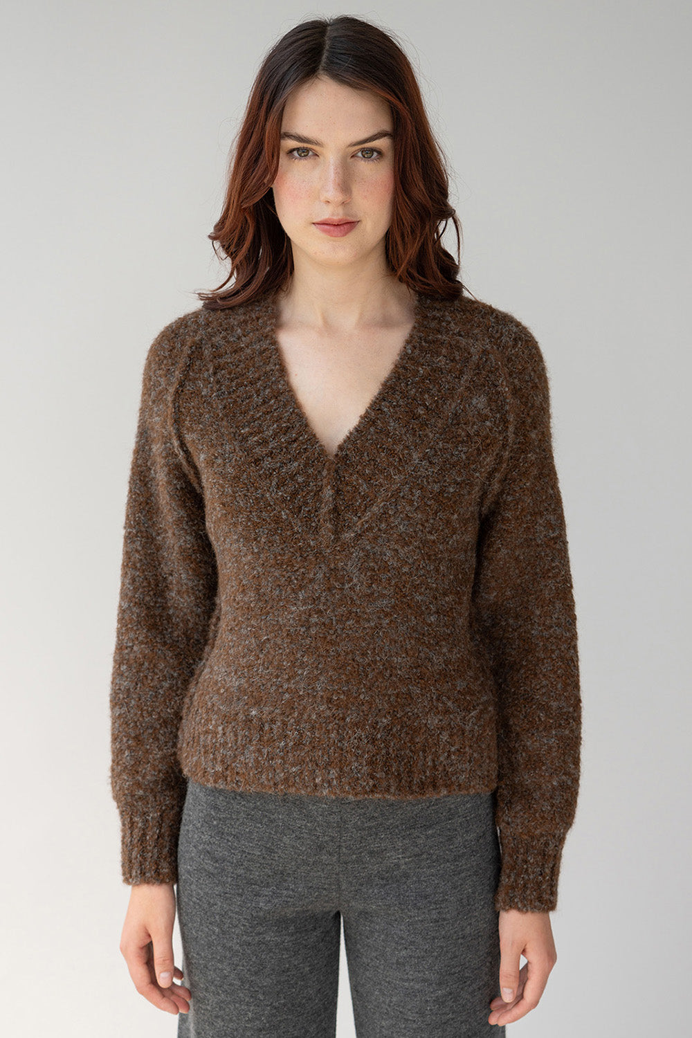 Grey maple alpaca pullover features a low v in front knitted in soft texture boucle yarn