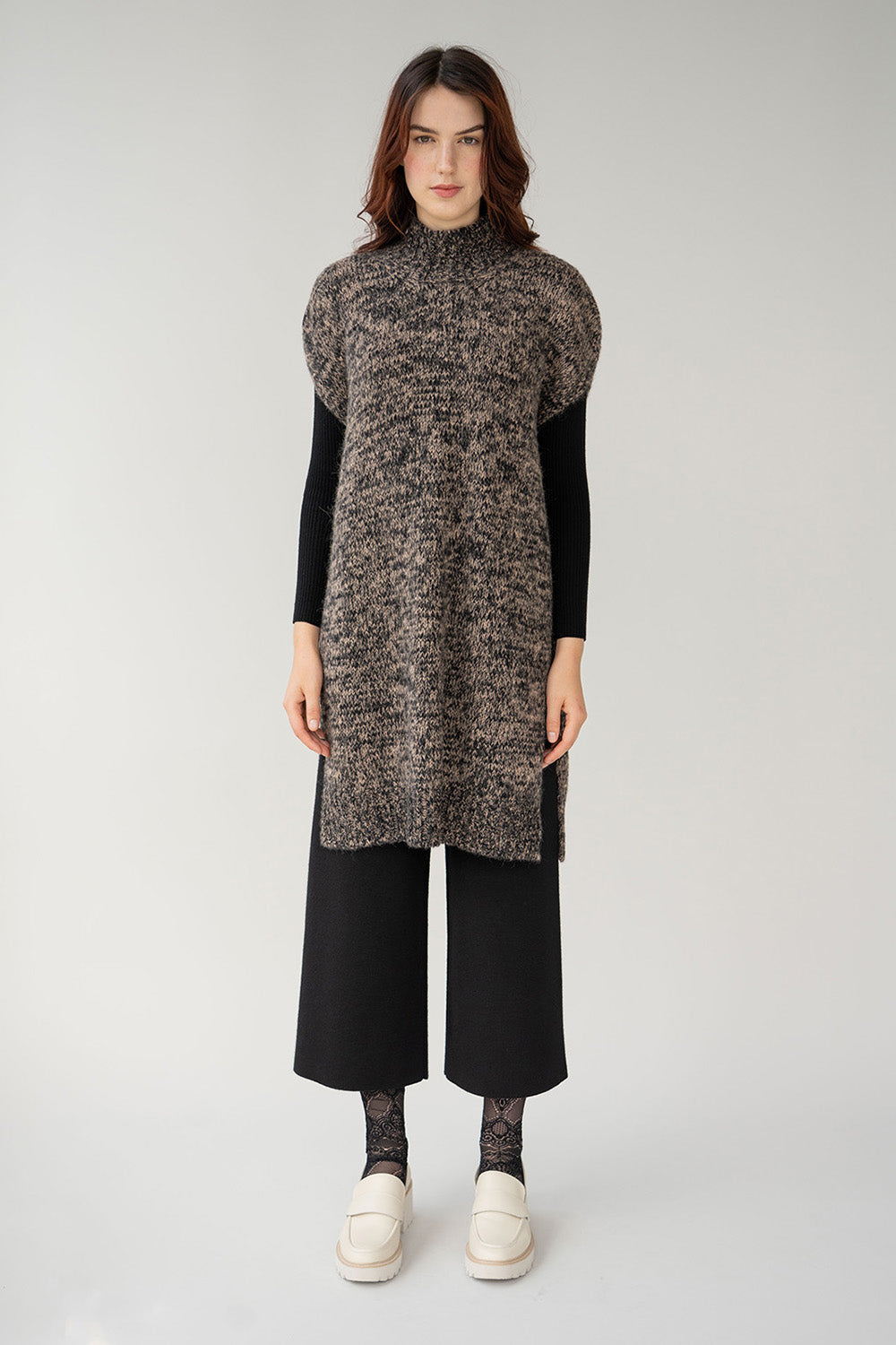 Long mock neck tunic vest in brown black marl made from alpaca length hits above knee