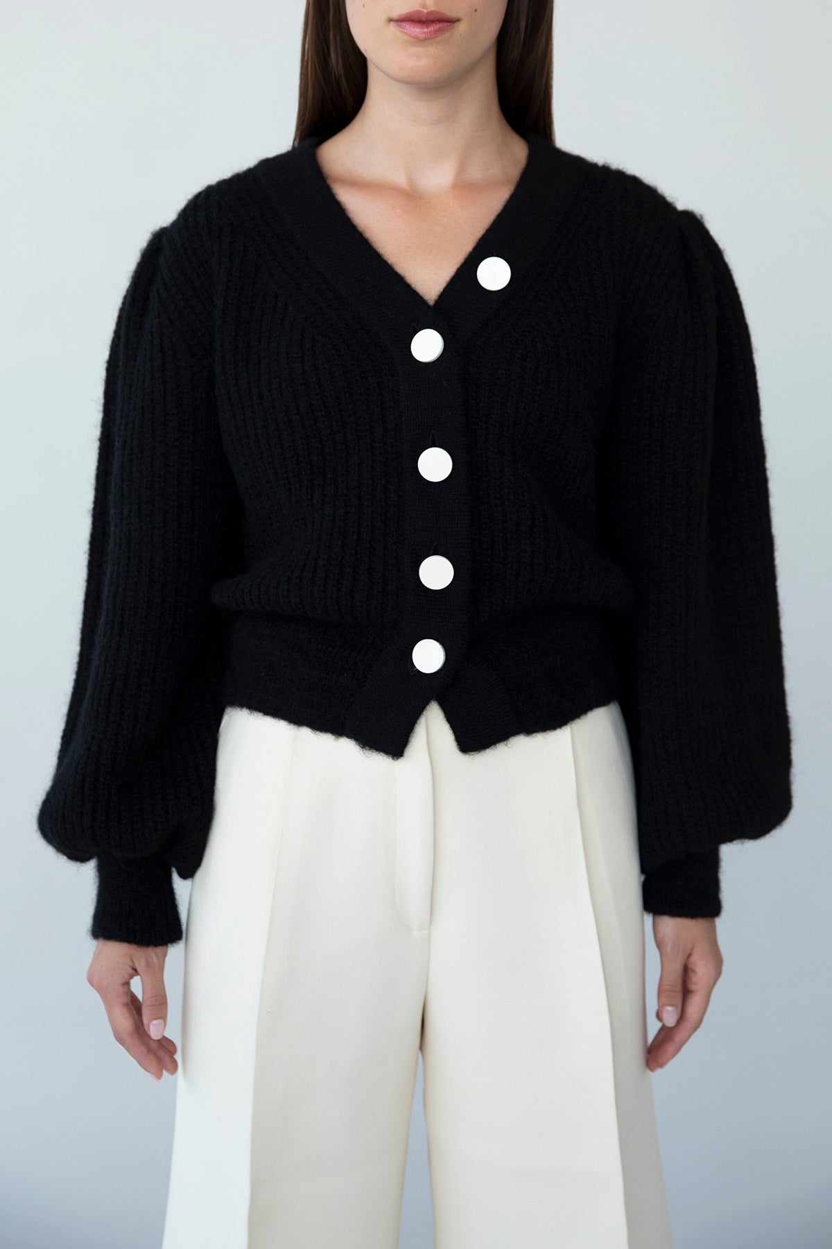 Front view of black Meredith Peck Cardigan crafted from sustainably sourced baby alpaca wool in Peru.