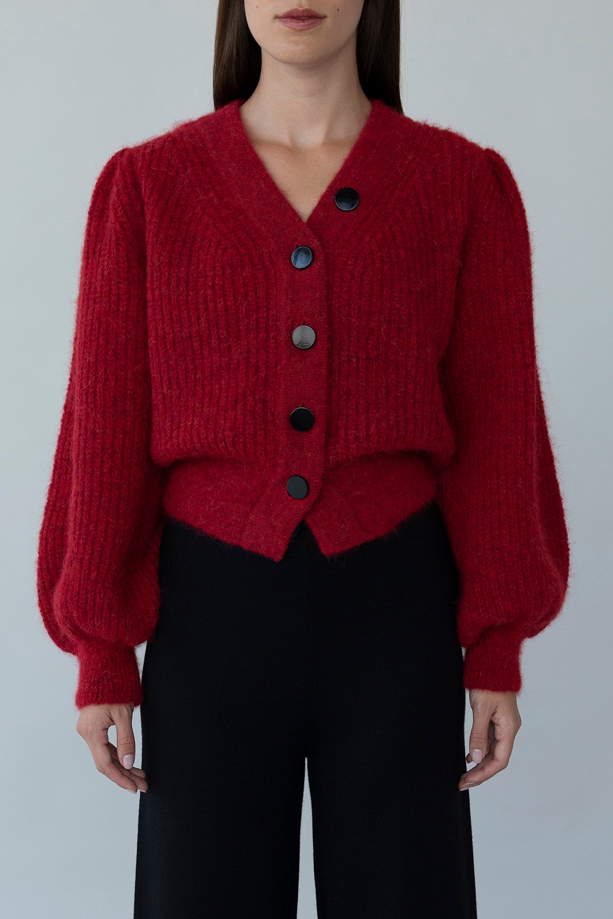 Front view of crimson red Meredith Peck Cardigan crafted from sustainably sourced baby alpaca wool in Peru.
