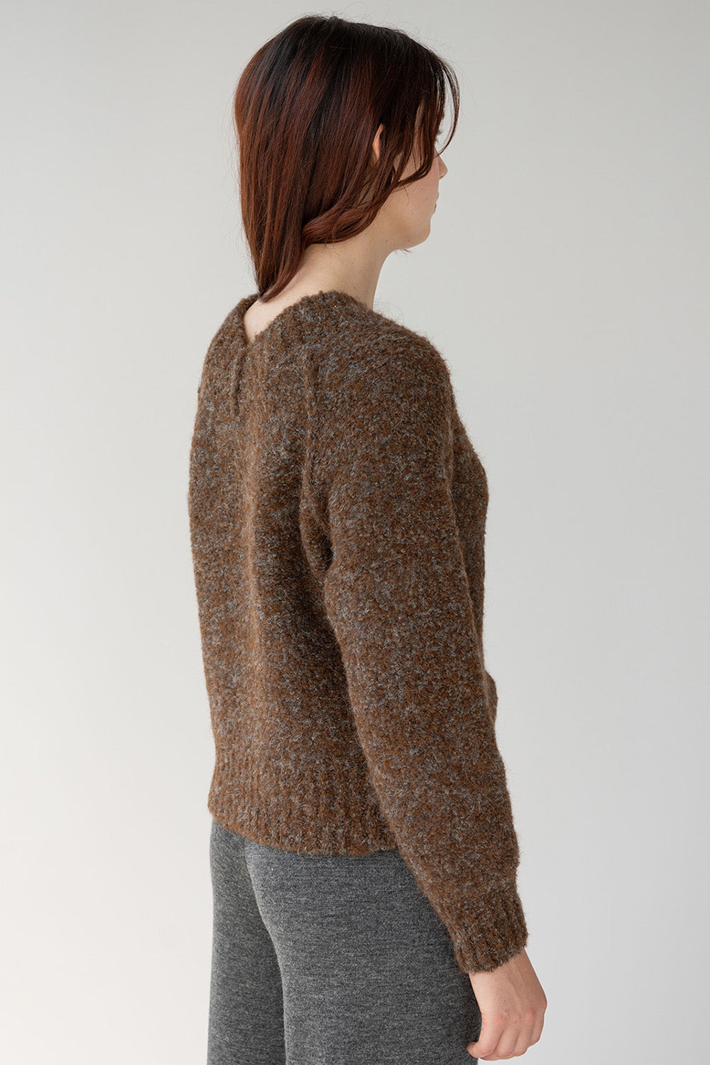 High v neck on back of brown long sleeved alpaca boucle sweater 