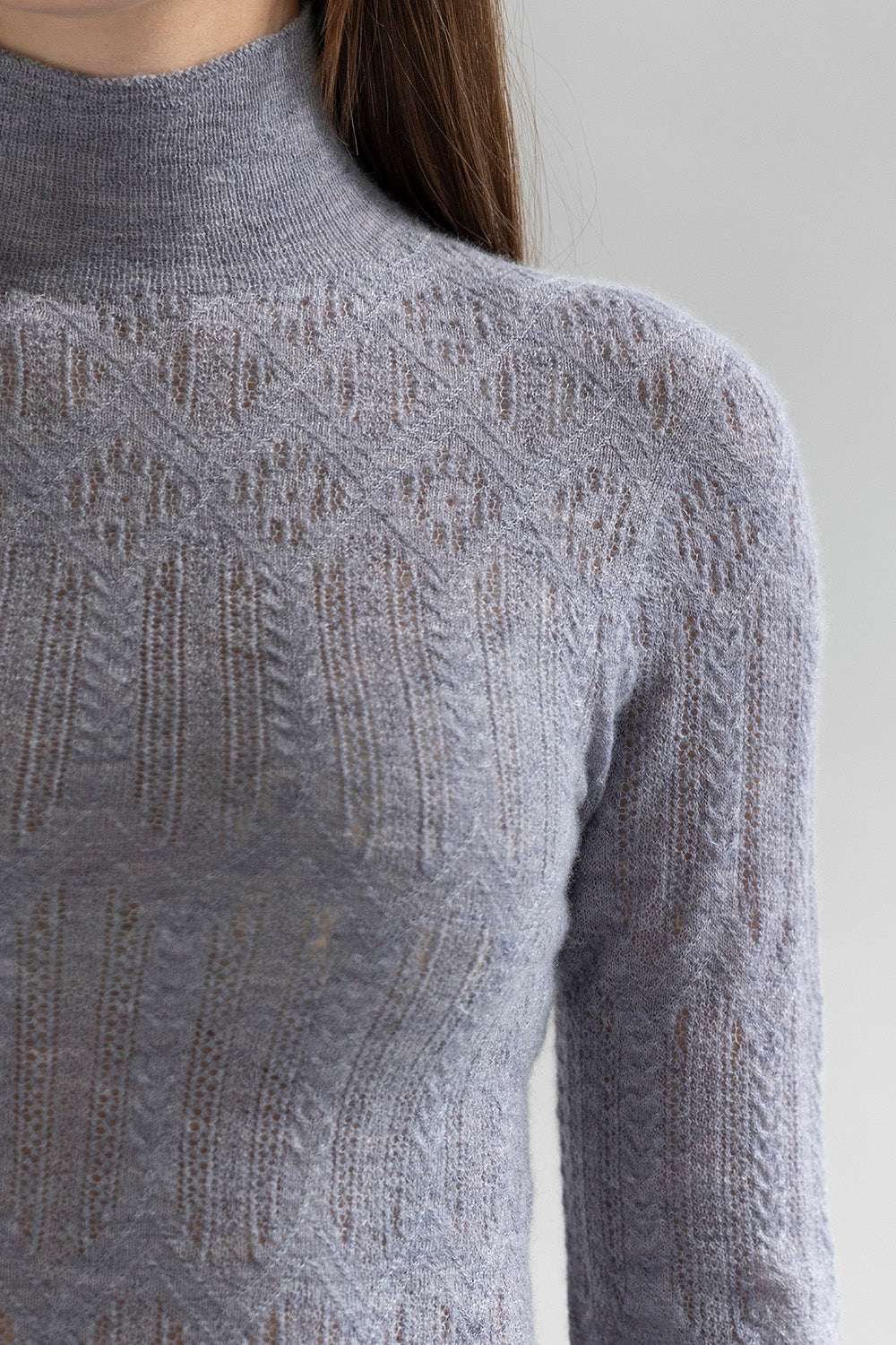 Close up shot of pointelle details on the glint grey cashmere sweater.