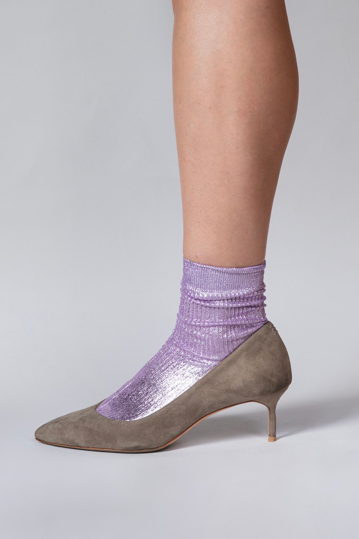 Close-up of the ribbed texture and laminated sheen on the lilac Lumine silk socks