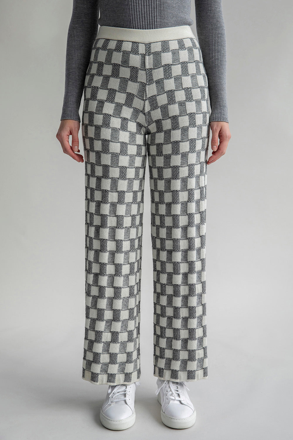 Front view of Zoe Trousers reversed to reveal a lighter colorway with a graphic-checked jacquard pattern.