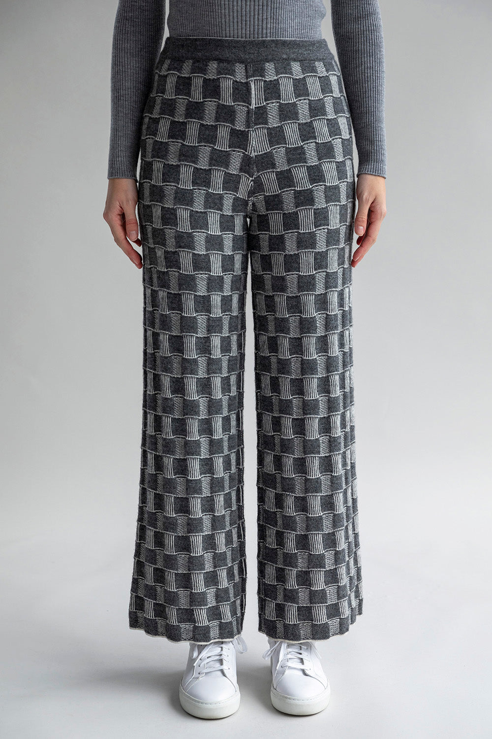 Front view of Zoe Trousers in graphic-checked jacquard pattern, showcasing the darker colorway.